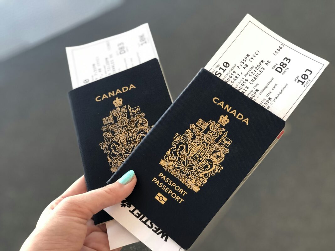 Canadian passport with maple leaf emblem and dark blue cover